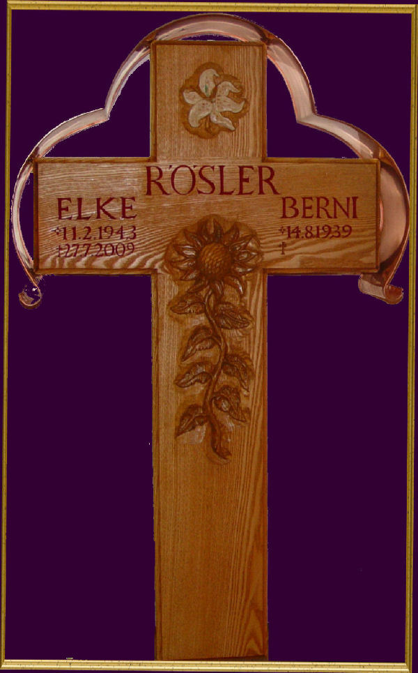 Grave cross made of oak with lilies and sunflowers relief